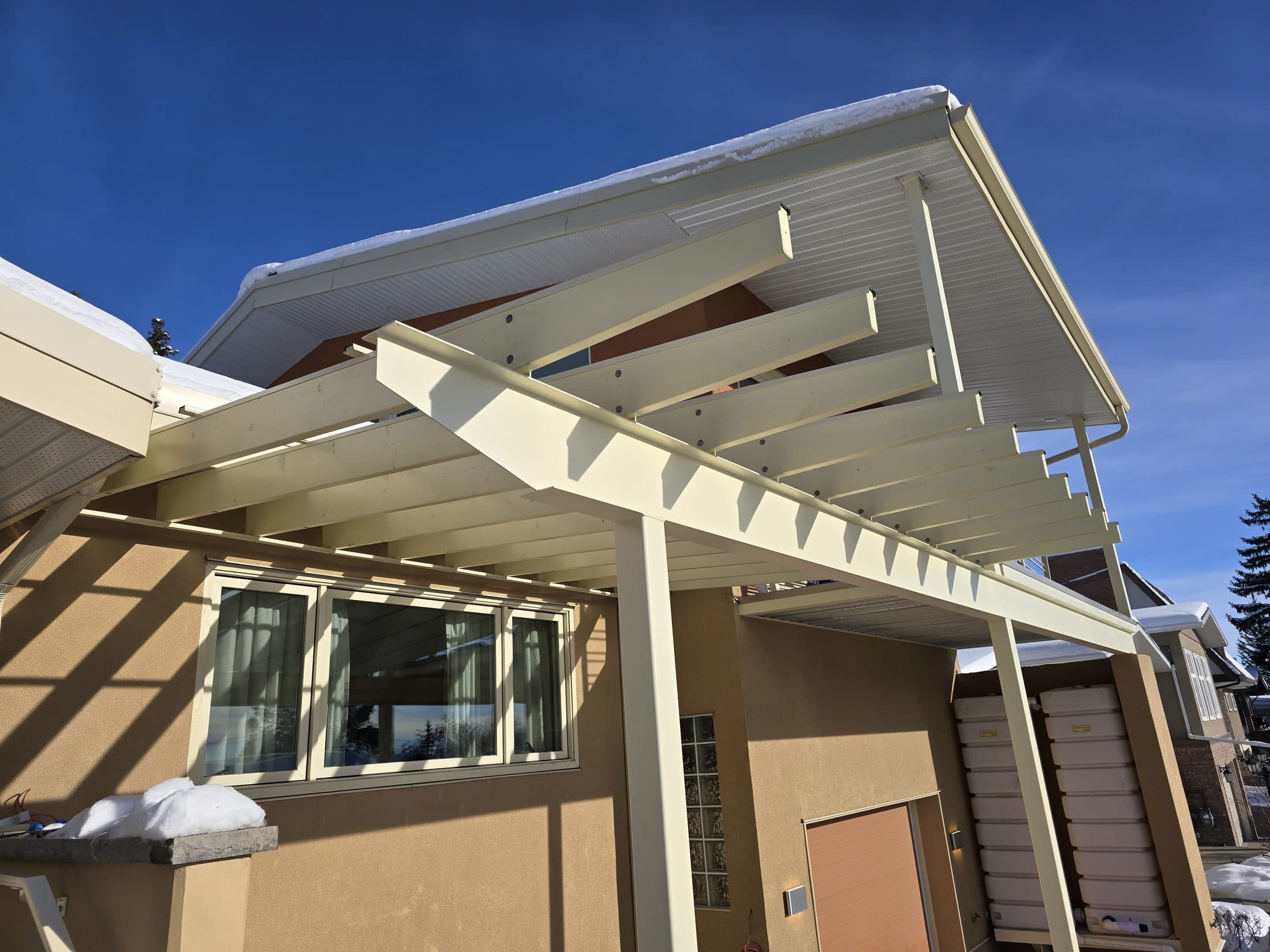 Pergola canopy over the entry of a modern home